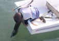 It is too difficult to install the regular Optimist rudder without assistance